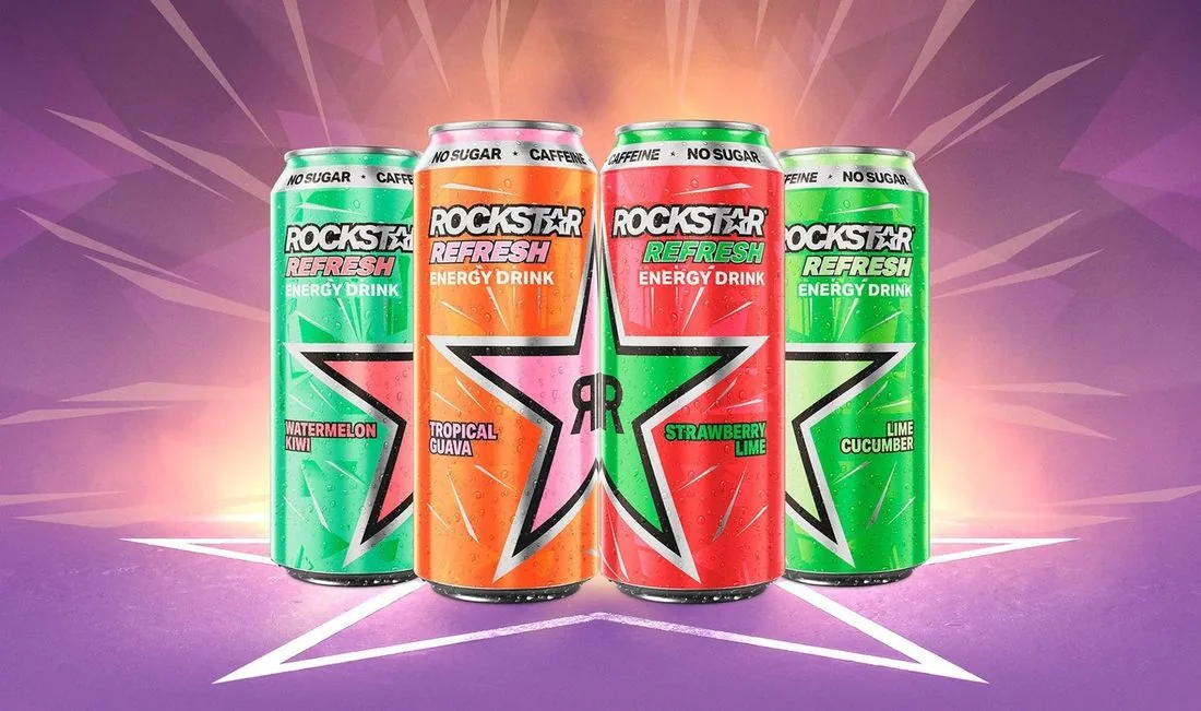 Four cans of Rockstar Refresh no-sugar energy drink, Watermelon Kiwi, Tropical Guava, Strawberry Lime and Lime Cucumber, on a purple starburst background